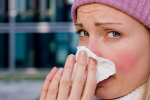 young female having a cold Allergies